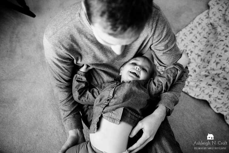 dad playing with toddler daughter