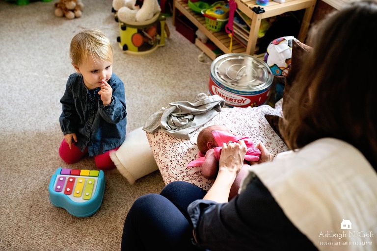 mom with newborn baby and toddler
