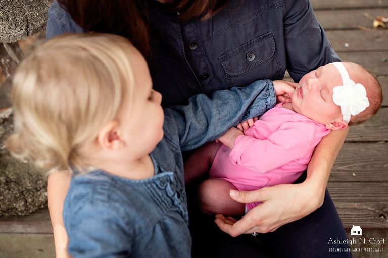 toddler girl and baby sister
