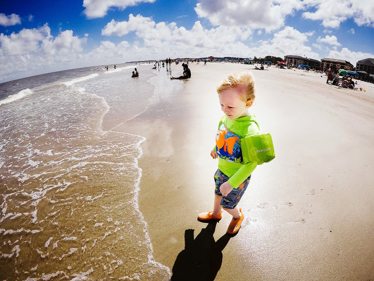 little boy playing on beach