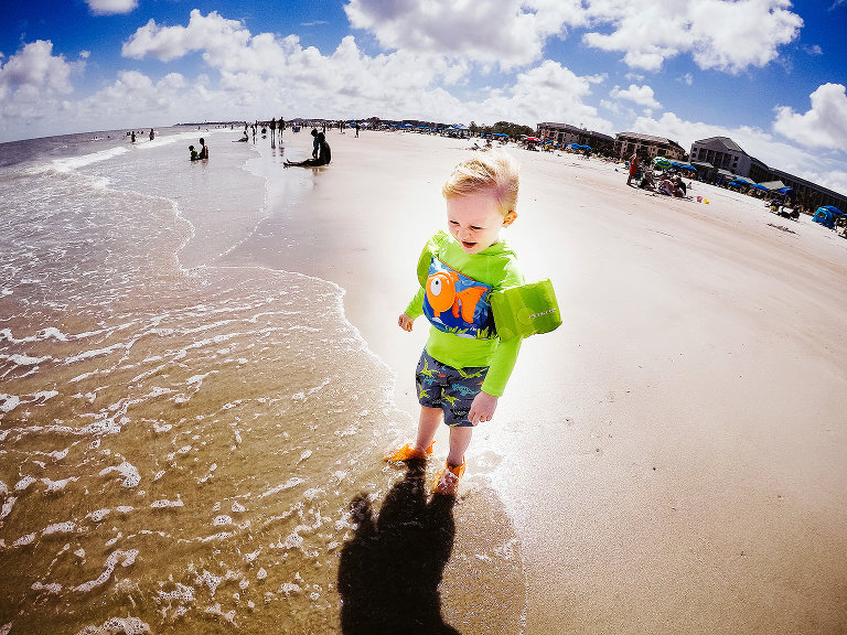 boy playing in ocean