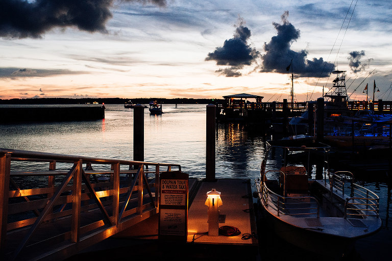 boat coming in to dock at sunset