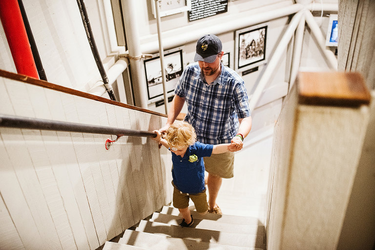 boy and father climbing stairs