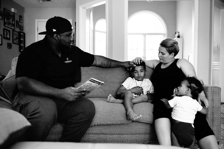 Family reading together on couch